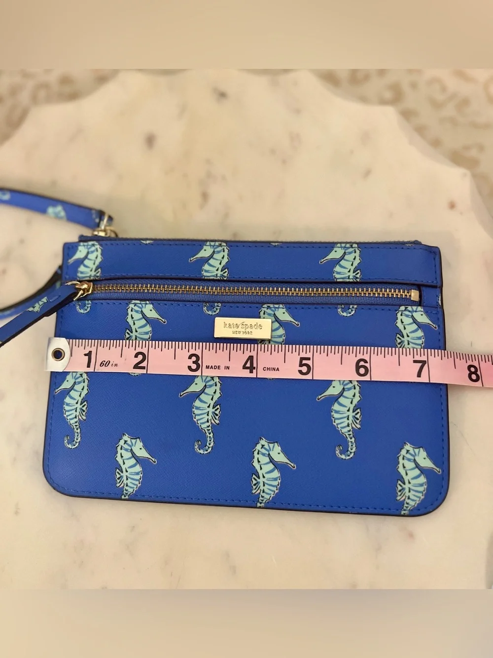 kate spade cobalt blue seahorse wristlet clutch